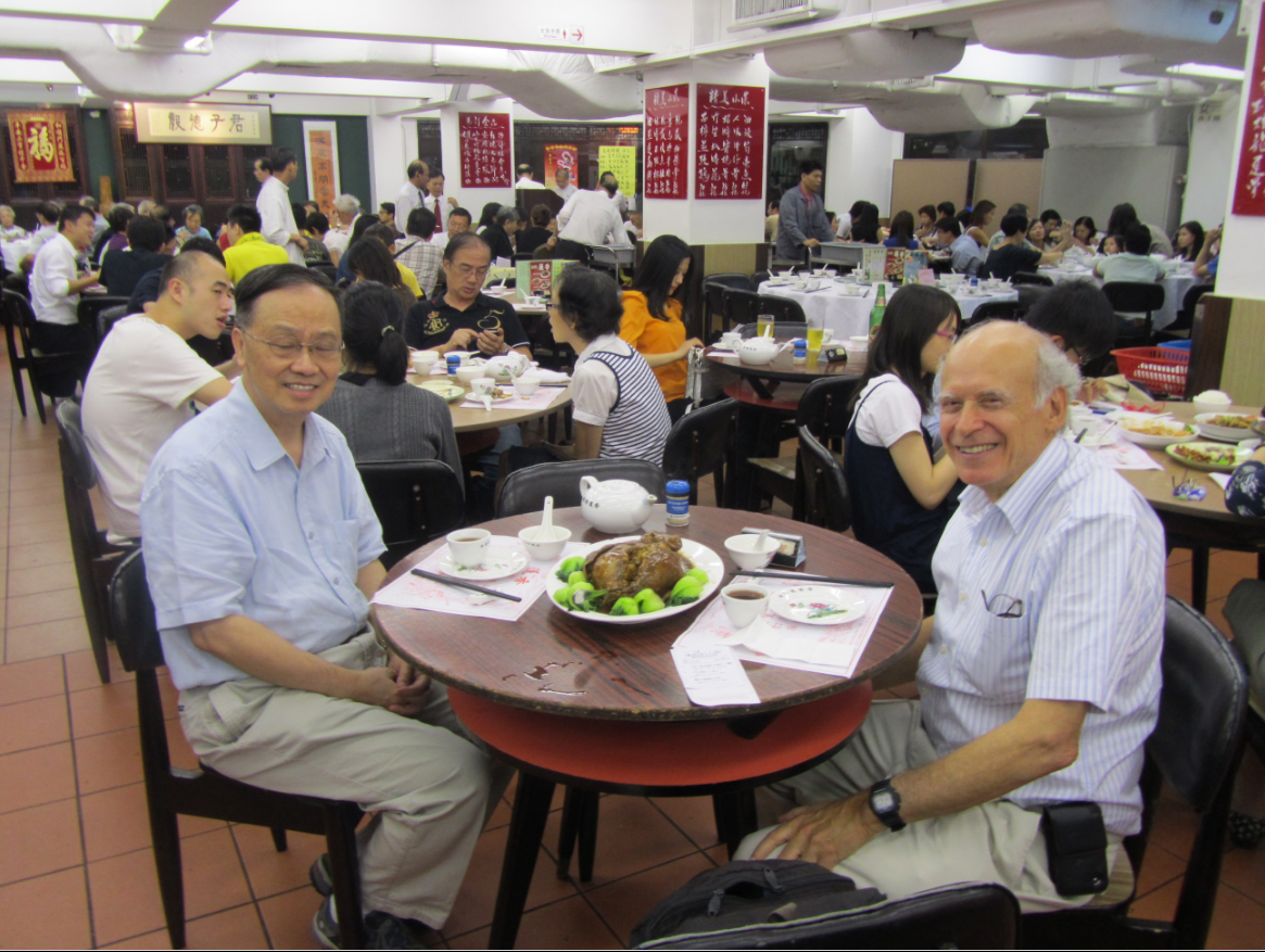 James Pick eating dinner with Professor K. Hung Chan in Hong Kong